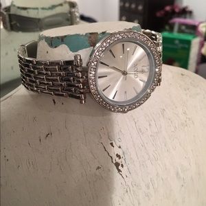 XOXO women's silver tone watch with bezels