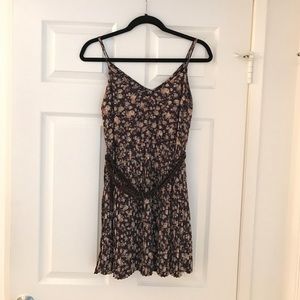 BROWN FLORAL DRESS. BELTED WITH PLEATS. SIZE SMALL