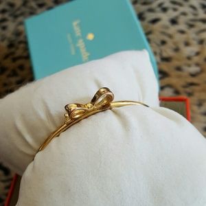 Worn Kate Spade gold small bow bracelet