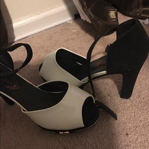 Pair of women's white-and-black leather shoes