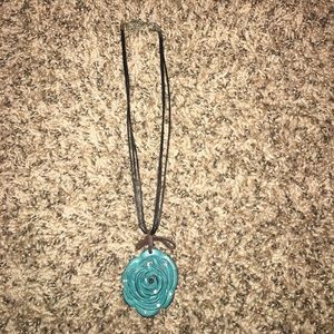 A turquoise/blue rose clay necklace!