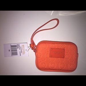 Michael Kors tangerine colored wristlet