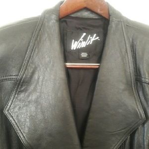 Full-length black woman's leather coat by Winlit.