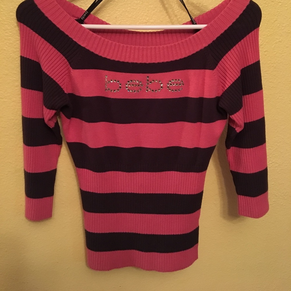 Bebe top with rainstones size large but can fit M