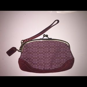 burgundy Coach wristlet with clasp
