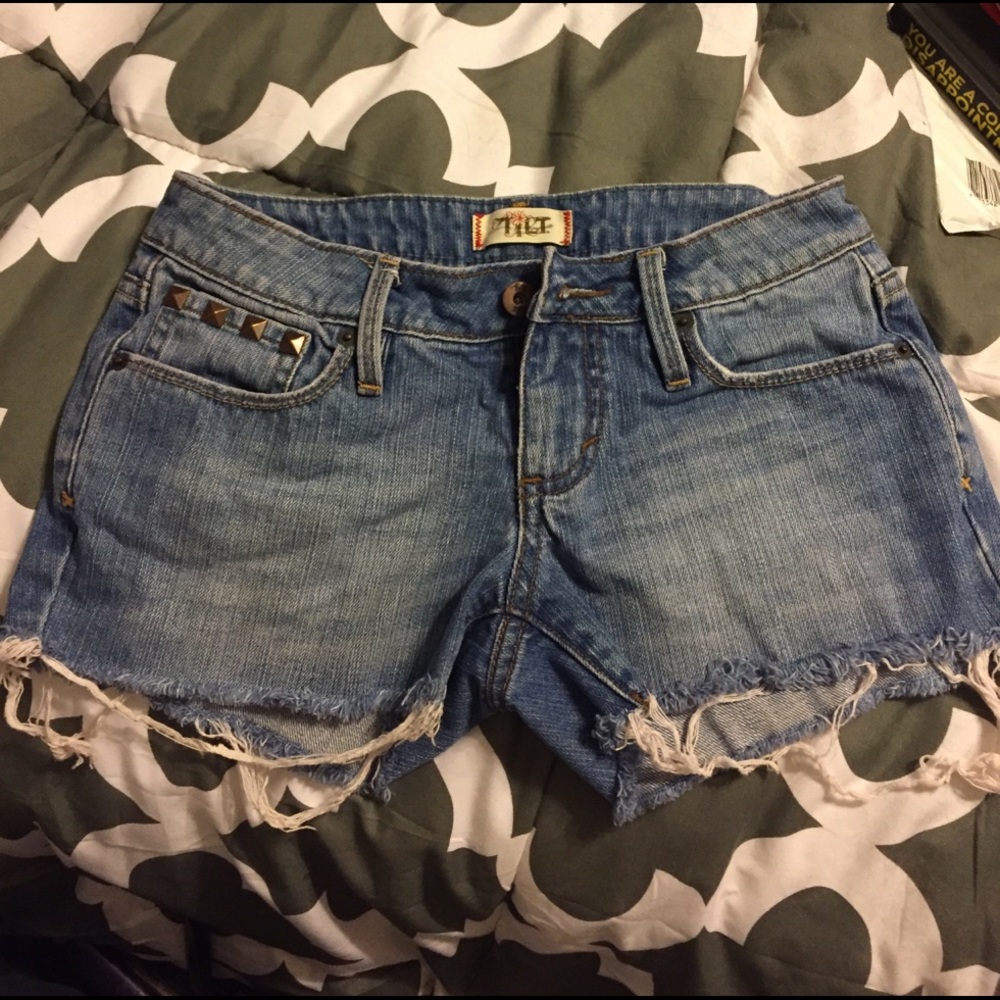 Distressed Tilt cutoff jean shorts.