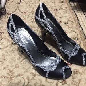 Super cool heels never worn! Peep toe, cut outs