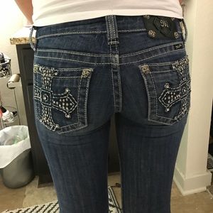 A pair of 26R Miss me jeans