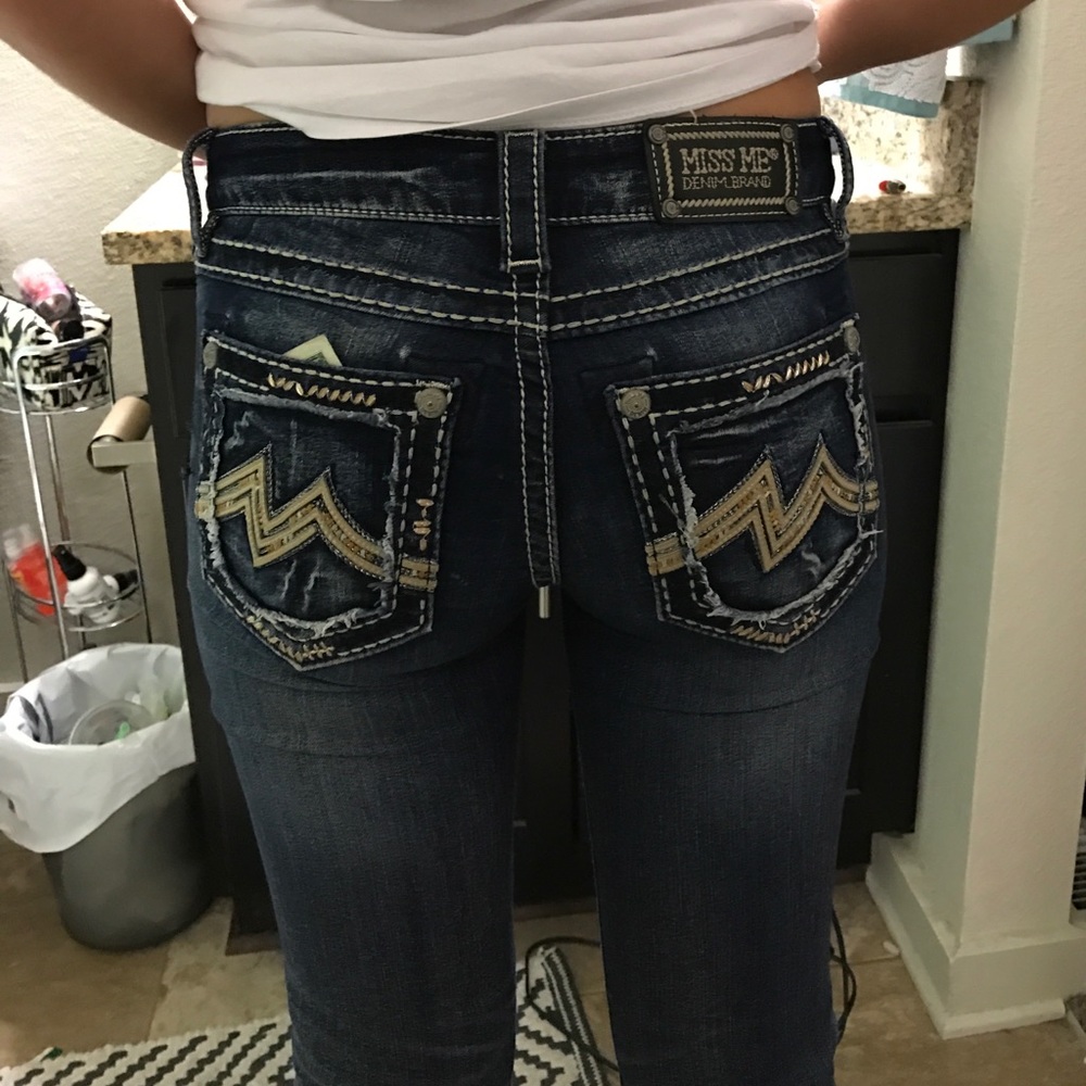 A dark wash miss me jean