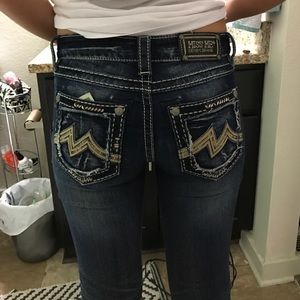 A dark wash miss me jean