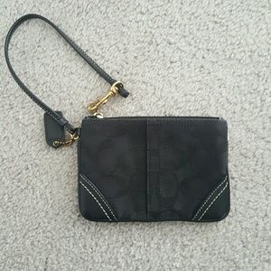 Black small coach wristlet.