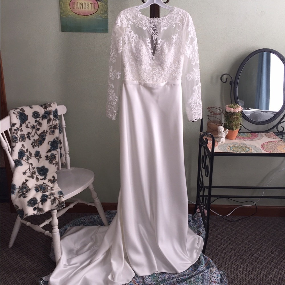NEVER WORN wedding gown. Unique 1 of a kind design