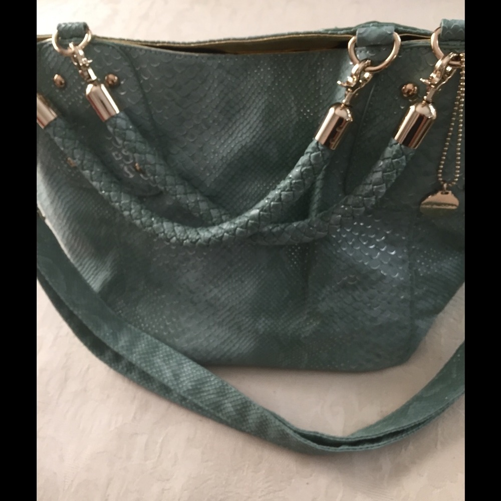 Large green bag with gold detailed.