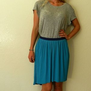Pleated reversible high to low skirt