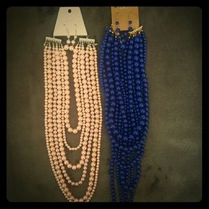 Long pearl necklaces.