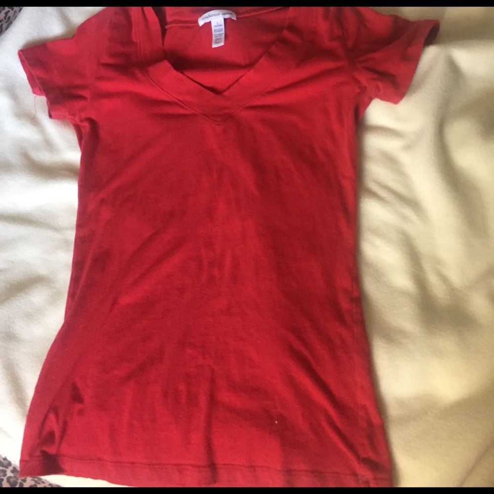A dark red t-shirt with a V neck