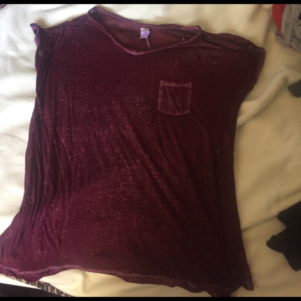 A maroon with spots of white shirt