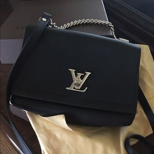 Black Louis Vuitton Lock Me crossbody purse