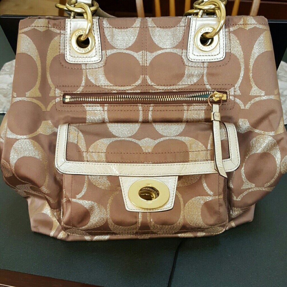 Beautiful metallic signature C coach handbag