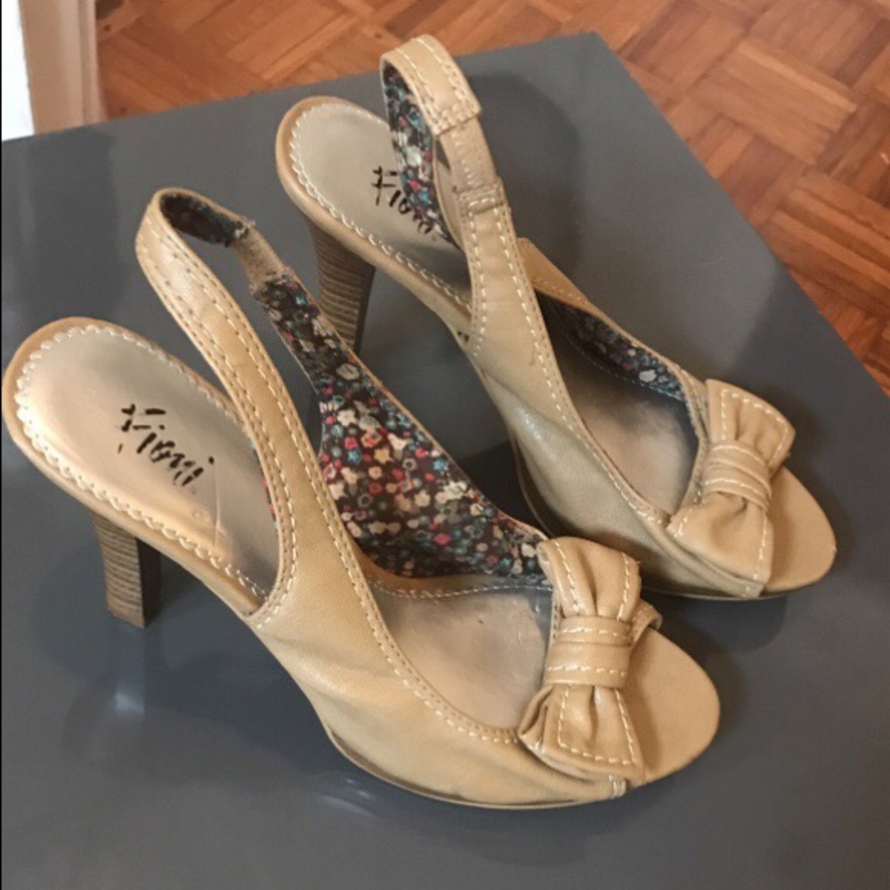 Pair of brown leather peep toe heels