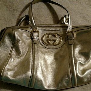 This is a roomy Gucci bag. It is in good condition