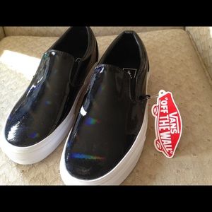 Black Vans slip-ons