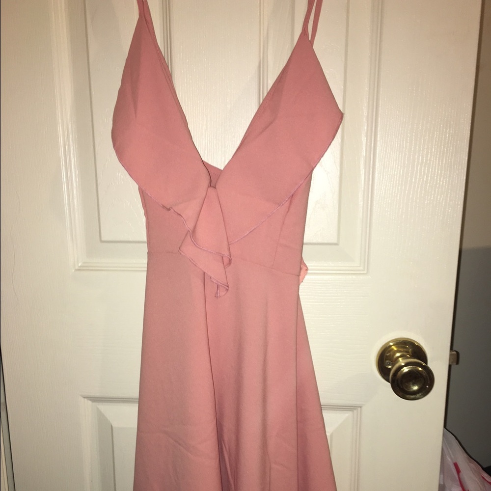 Pink plunge neckline dress with ruffle