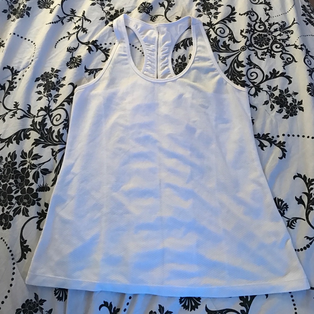 Nice top with cute details on back.