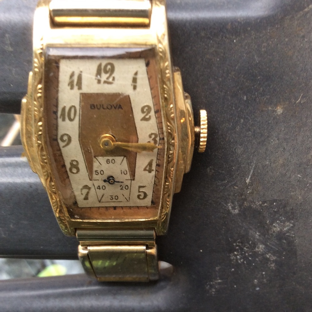 Bulova gold watch.