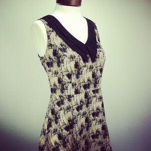 Sleeveless shift dress with drop-v collar