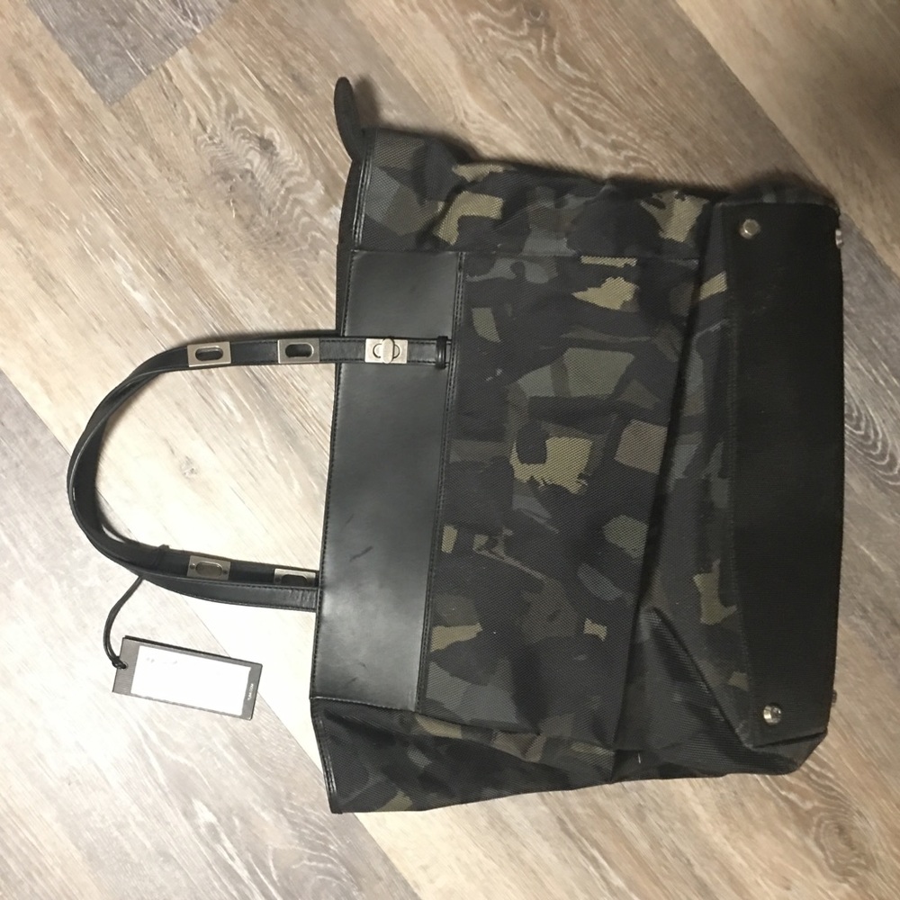 Tumi army colored bag new condition