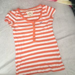 A orange and white striped hollister tee