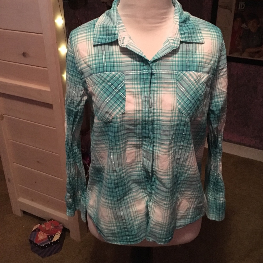 A girls blue plaid long sleeve shirt