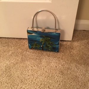 Island print evening bag.