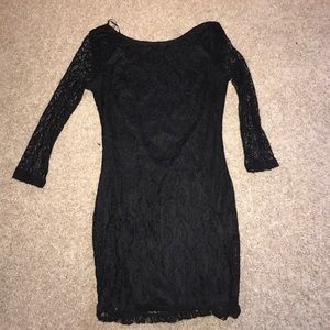 Black dress. Open cross back.