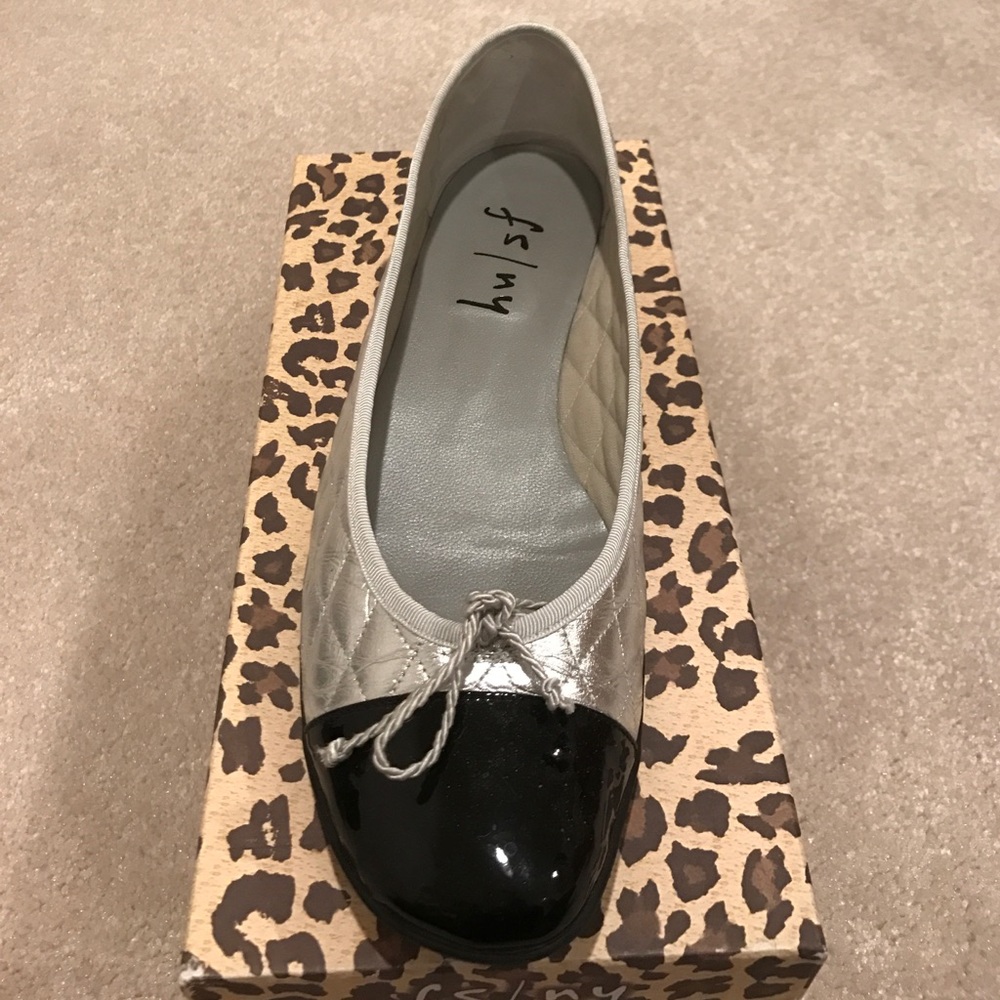 Silver quilted flats with black patent leather toe