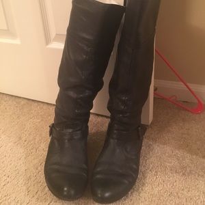 Steve Madden black flat boots with a buckle