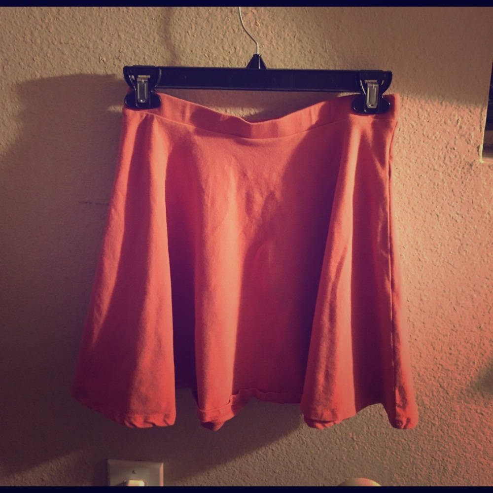 This is a mid thigh, summer tulip skirt- peach