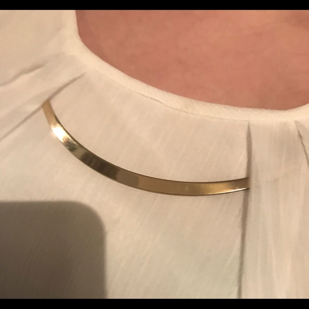 Cream colored blouse with beautiful gold accents