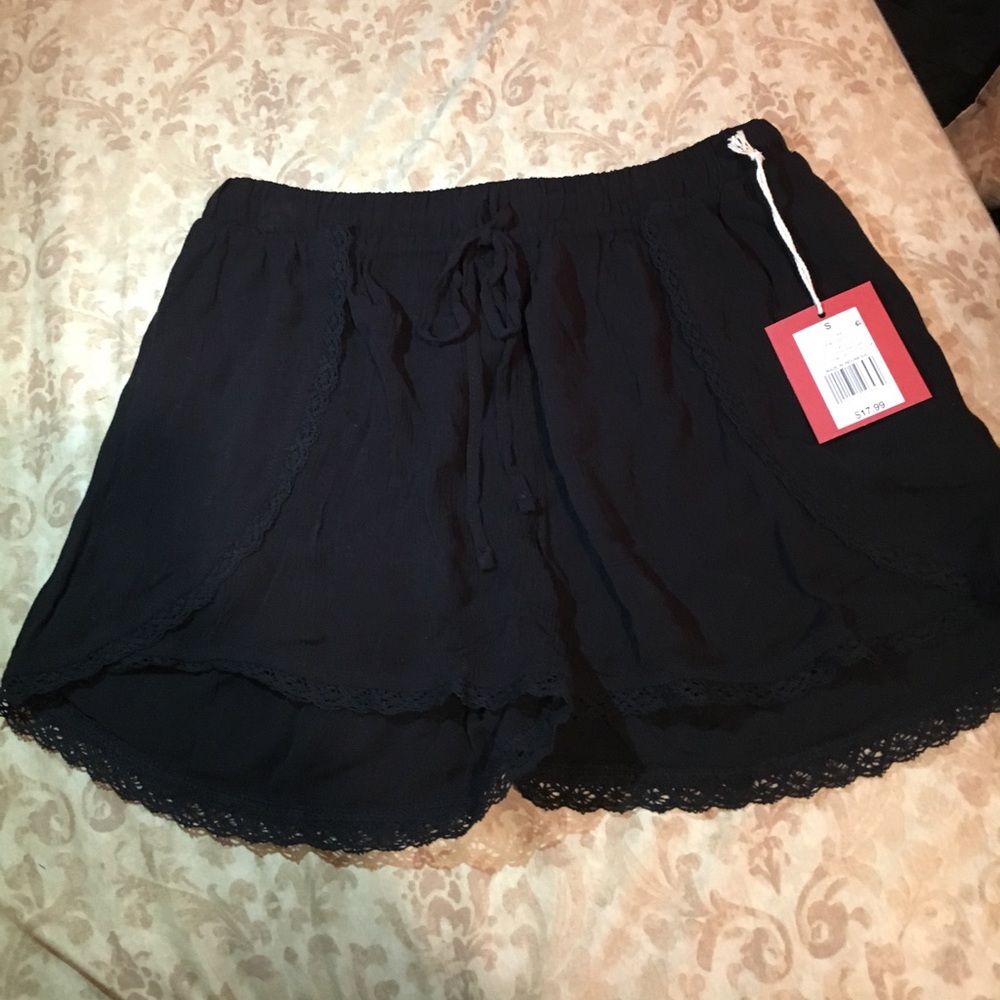 Black shorts with lace on the bottom