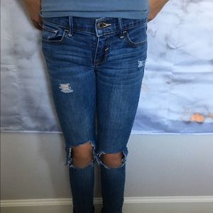 Abercrombie kids ripped jeans.