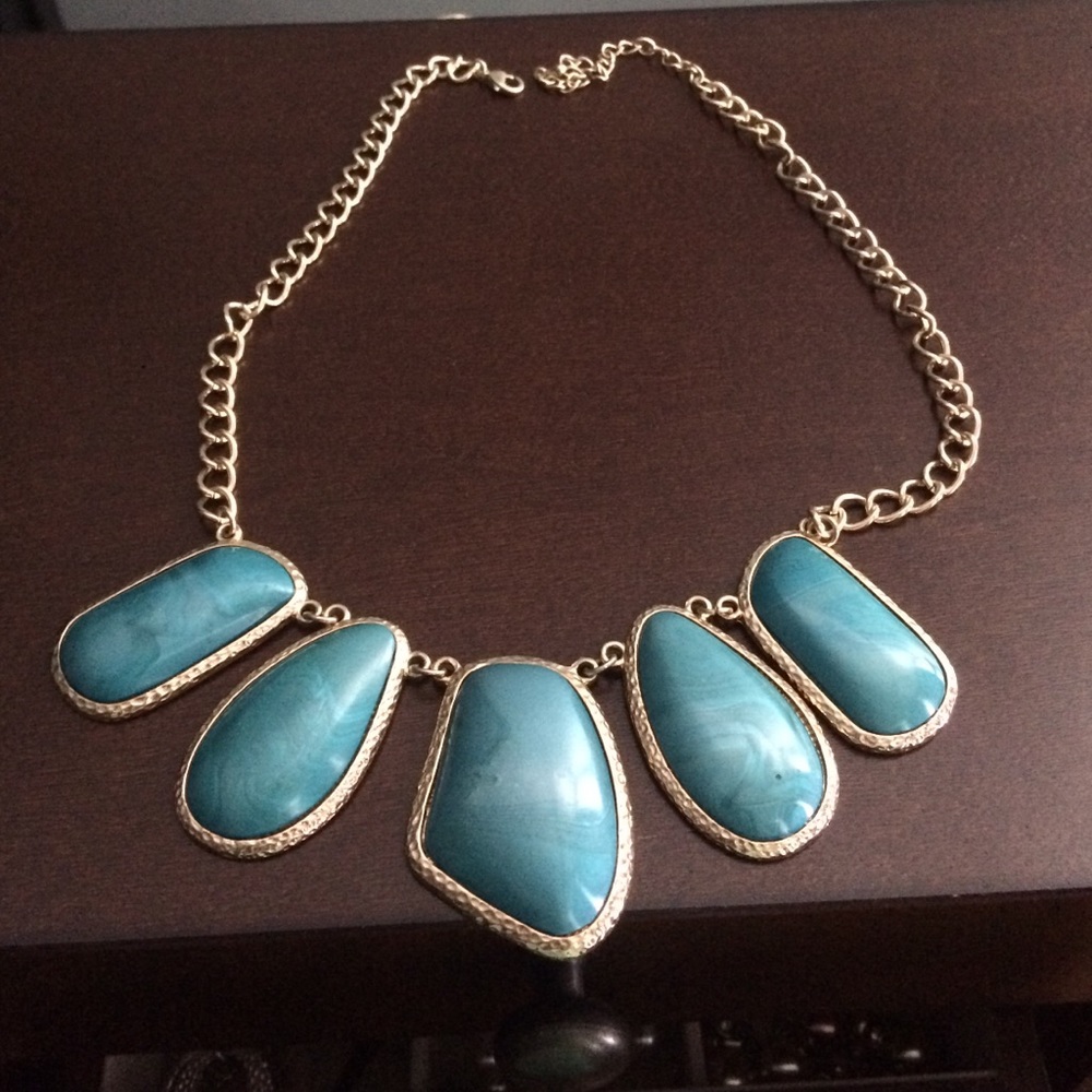 Turquoise and gold colored necklace