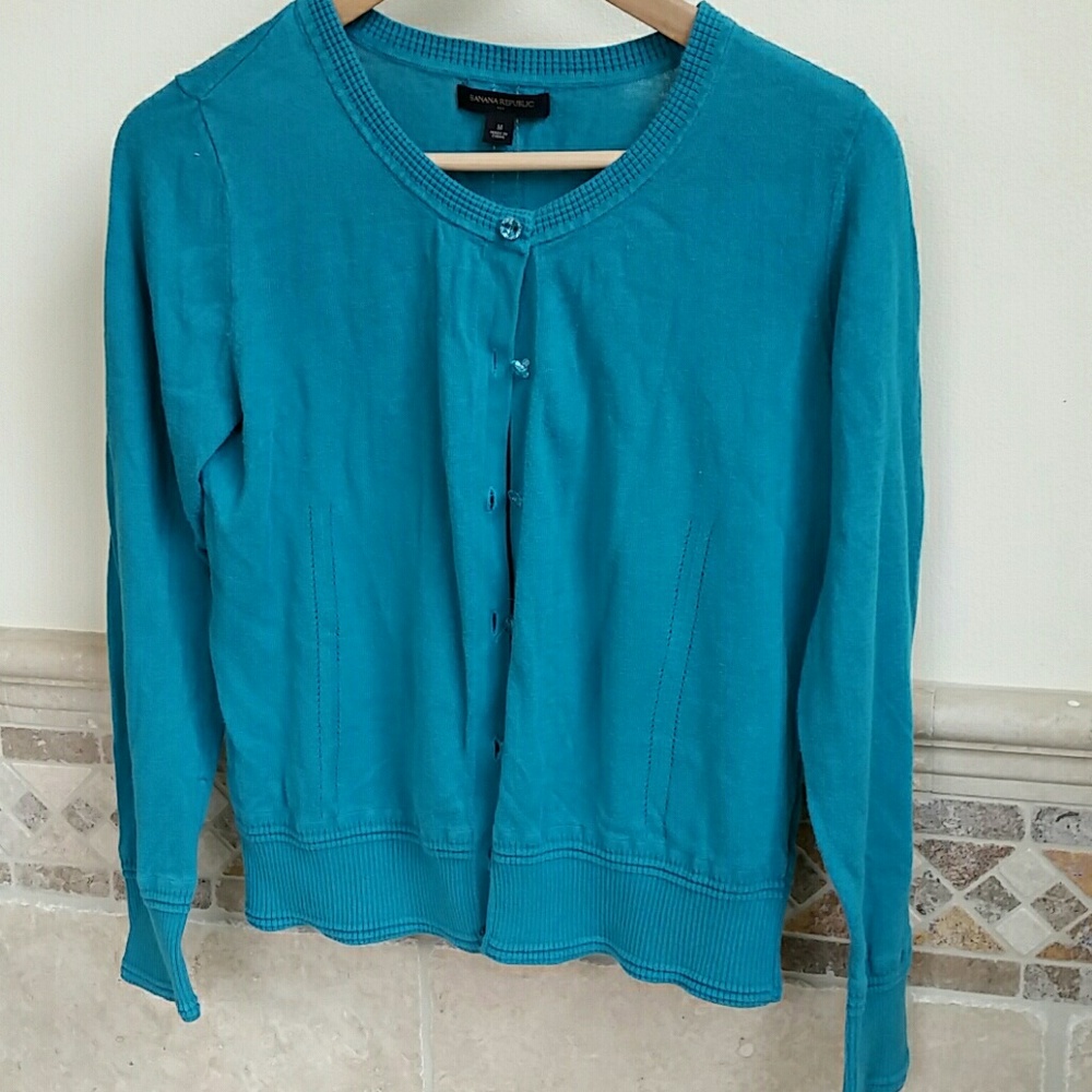 Teal sweater with crystal look buttons