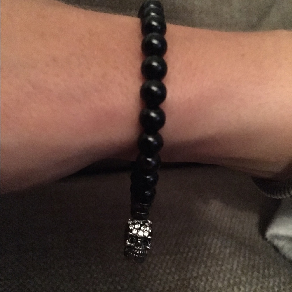 NWT black & gunmetal skull bracelets