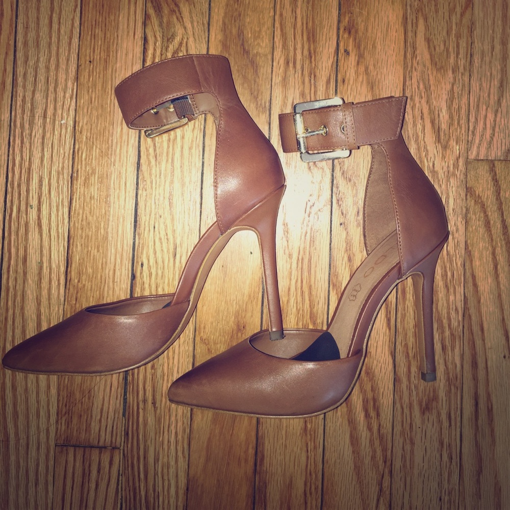 Aldo Astfeld strap stiletto heels w/ gold buckles.