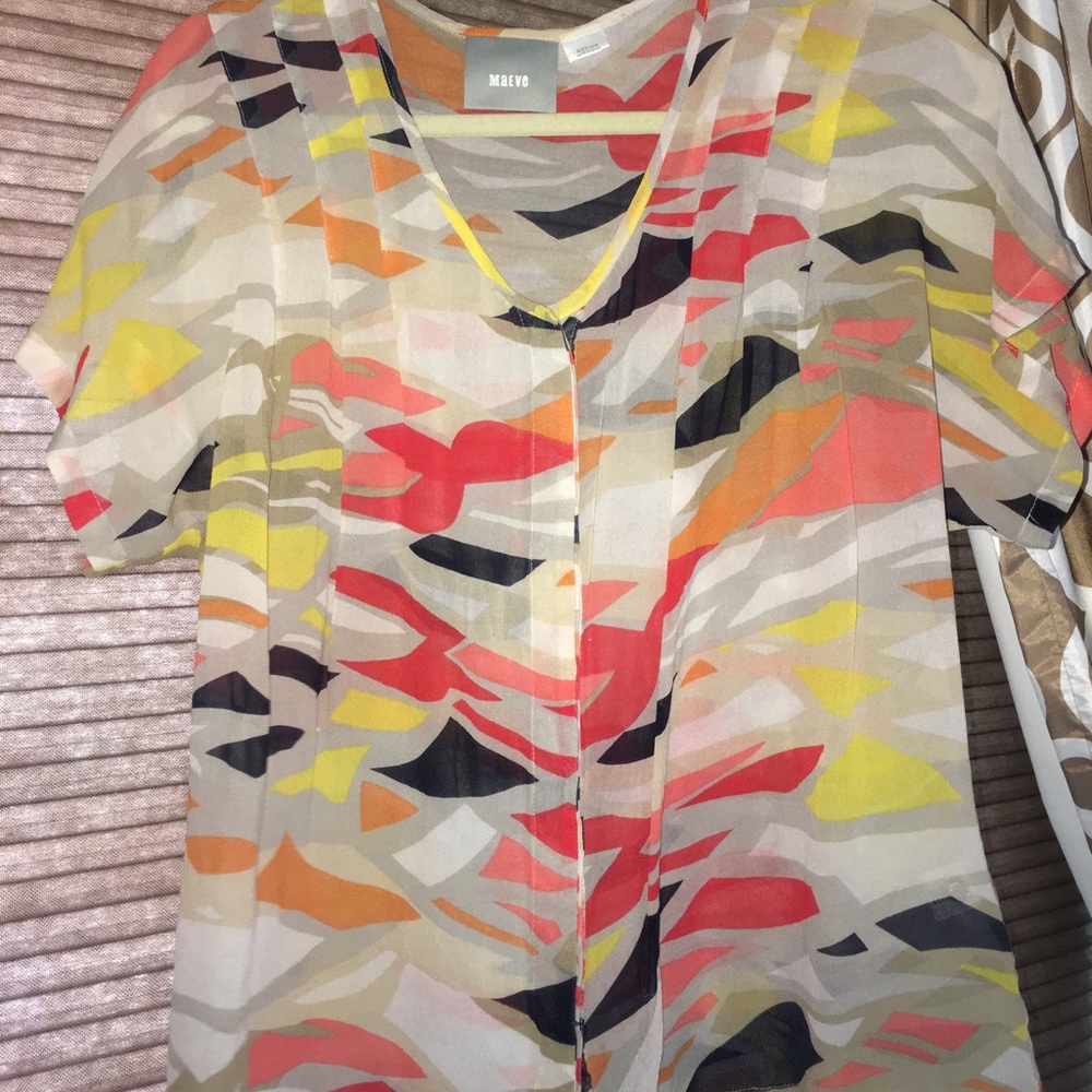 Colorful button up blouse.