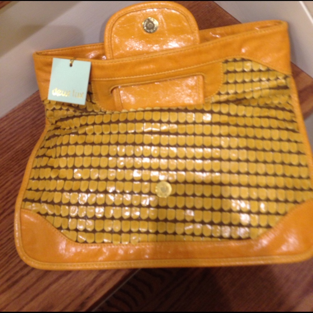 Mustard and tan clutch