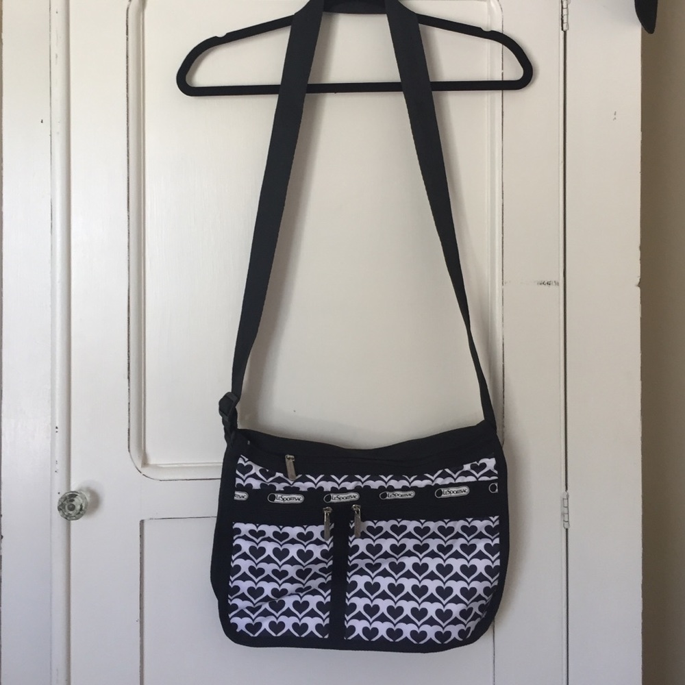 Black and white LeSportsac messenger bag.