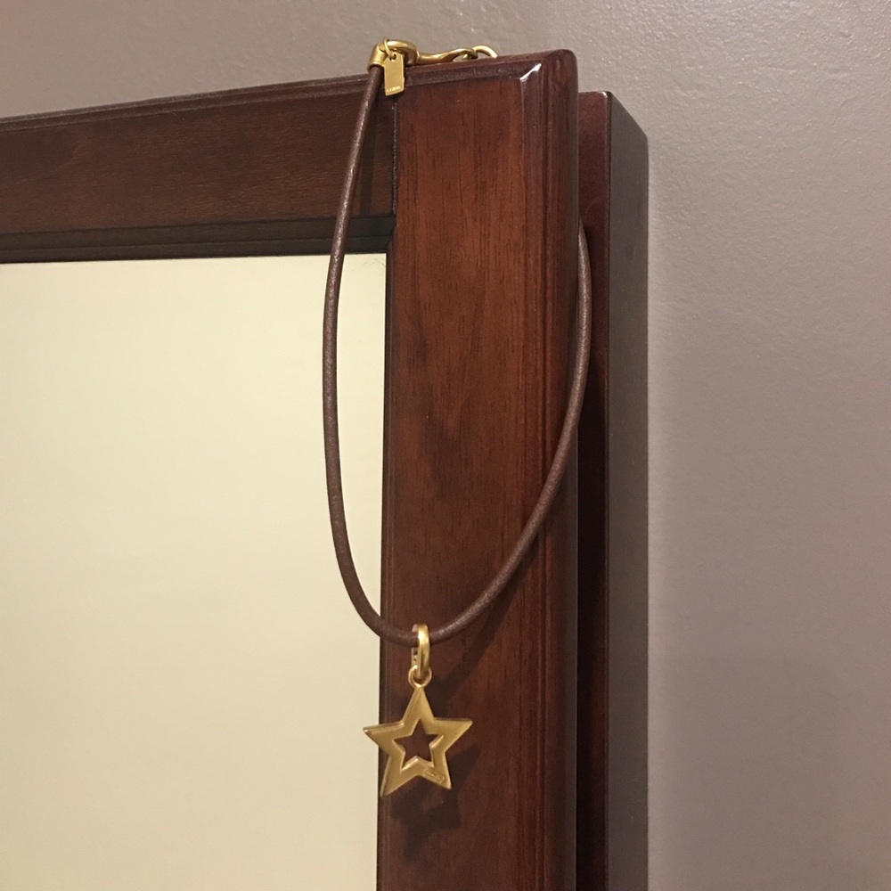 Brown leather Coach necklace with gold star