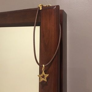 Brown leather Coach necklace with gold star